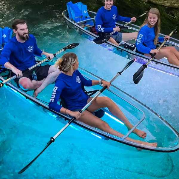 a group of people on a boat in the water